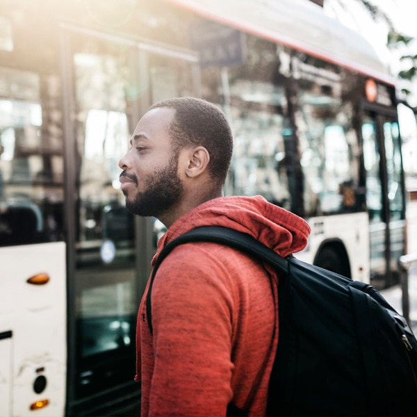 man commuting by bus