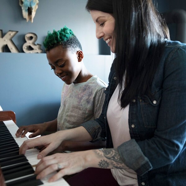 Parent and child at piano