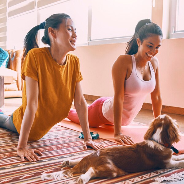 two ladies practicing yoga