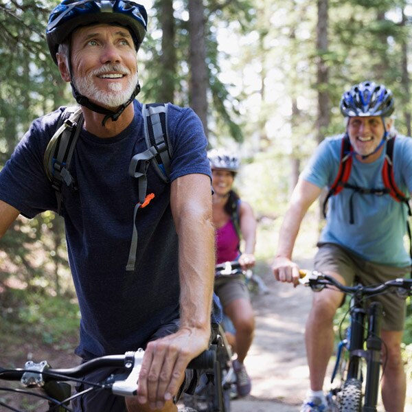 friends cycling in the woods