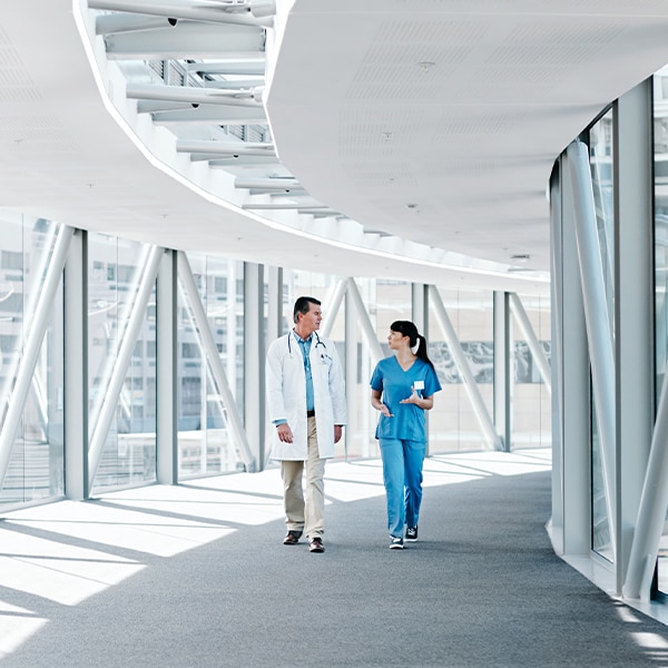 Doctors walking through hospital overpass