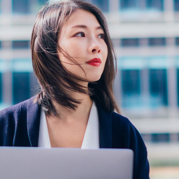 Woman looking up from computer.