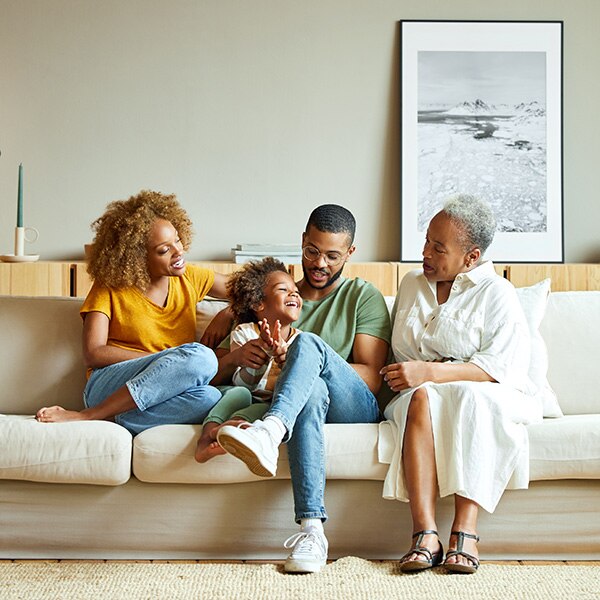 Family sitting on sofa