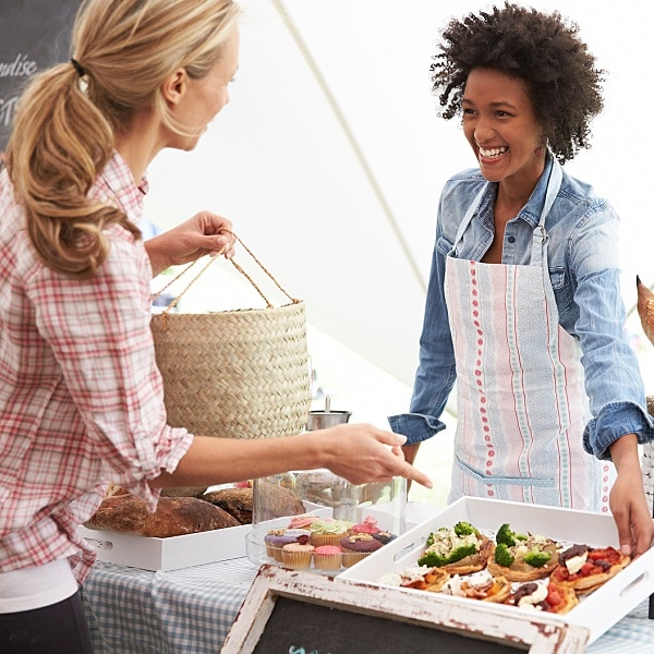 Female Bakery Stall Holder At Farmers Fresh Food Market