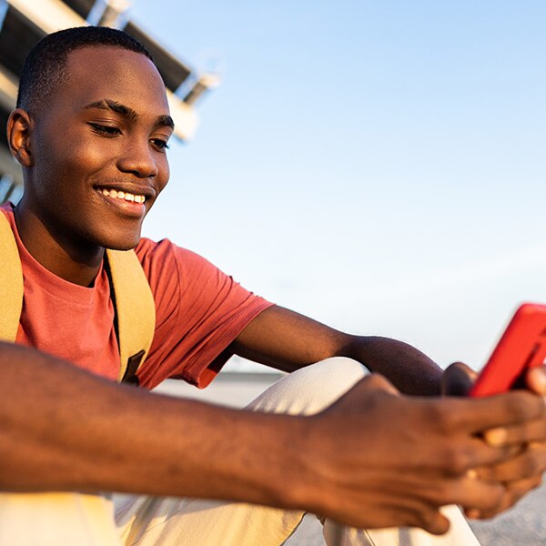 young adult looking at phone