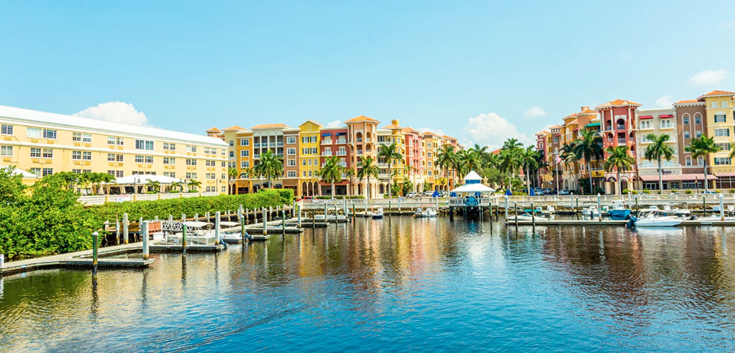 view from bay looking back at a coast of docks and colorful buildings