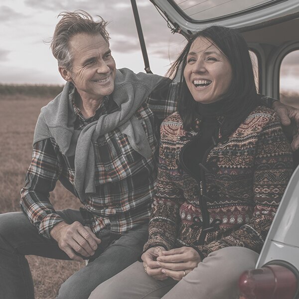 Laughing couple in outdoor setting